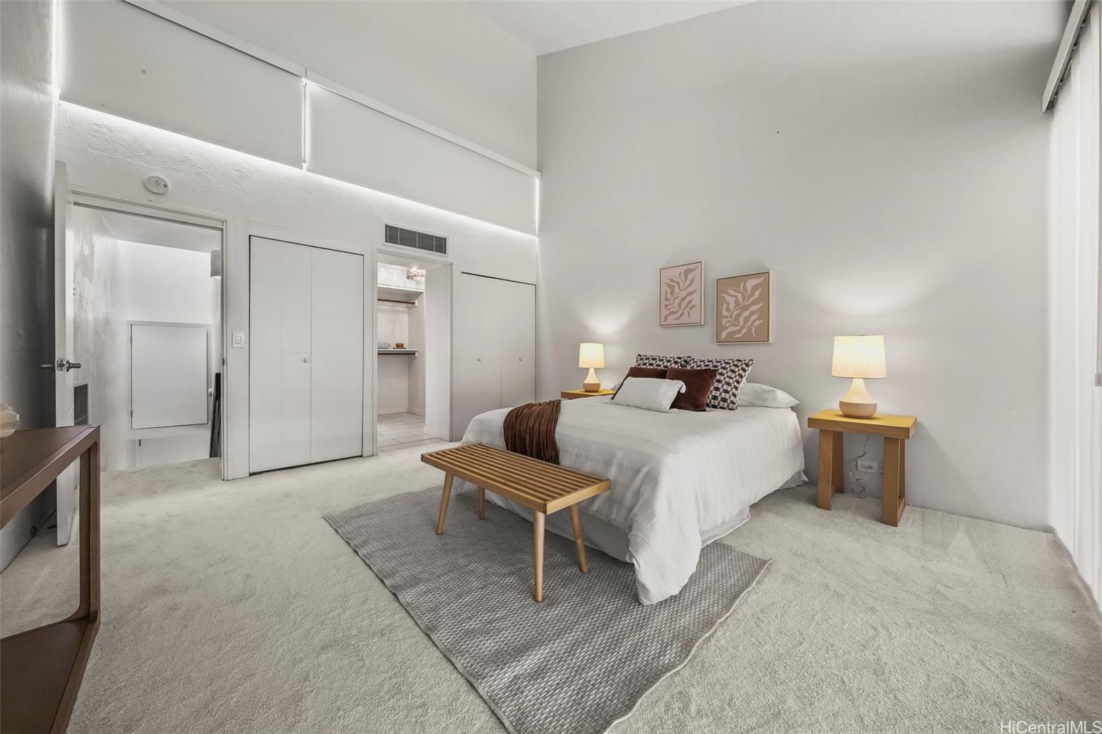 500 Lunalilo Home Road, Unit 17A Honolulu, HI 96825 - Photo 10 of 25 a bedroom with a bed and a mirror