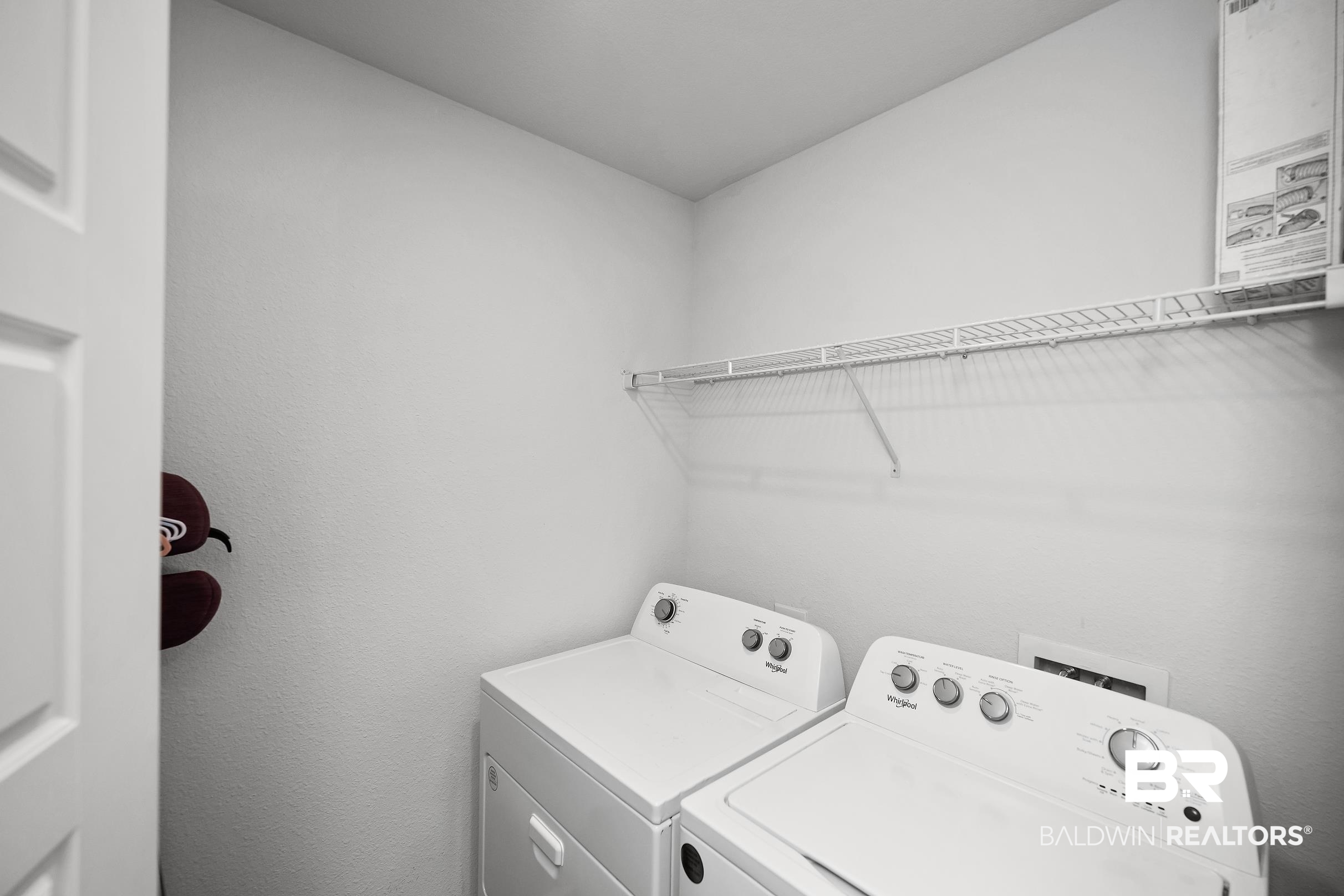 32030 Terranova Loop Lillian, AL 36549 - Photo 18 of 30 Dedicated laundry area featuring white walls and a wire shelving unit