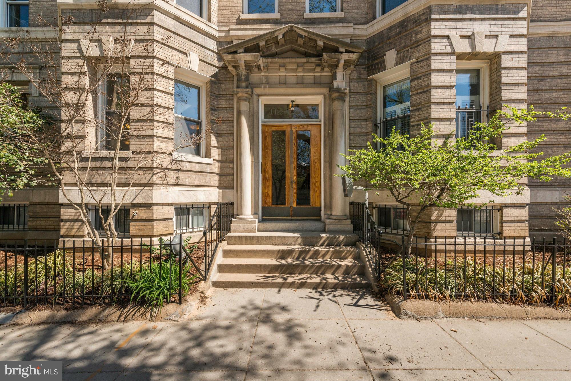 2605 Adams Mill Road Northwest, Unit 2 Washington, DC 20009 - Photo 1 of 30 a front view of a building with a garden