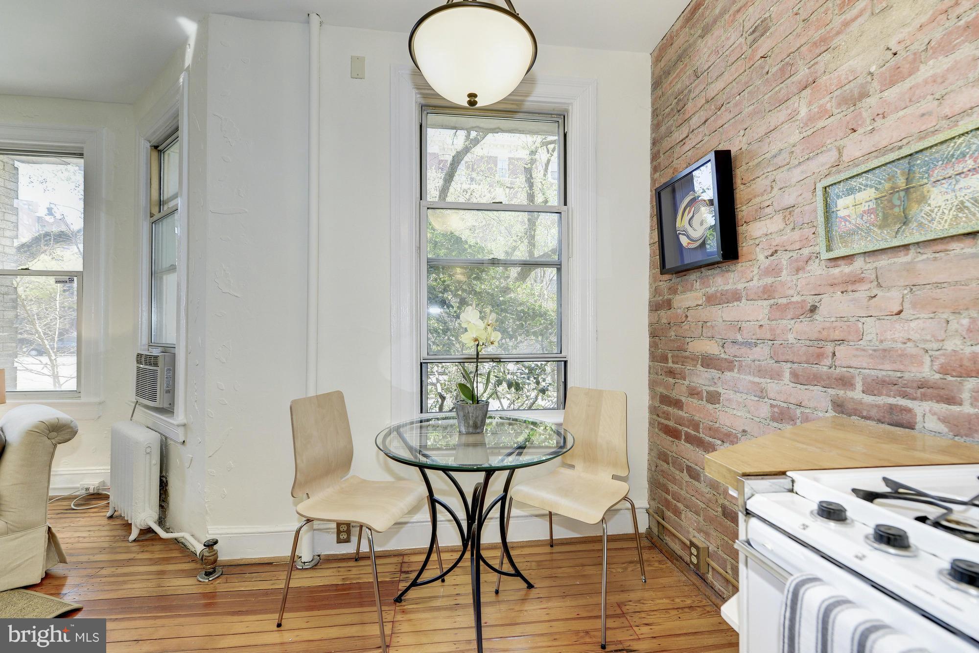 2605 Adams Mill Road Northwest, Unit 2 Washington, DC 20009 - Photo 12 of 30 a view of a dining room with furniture and wooden floor