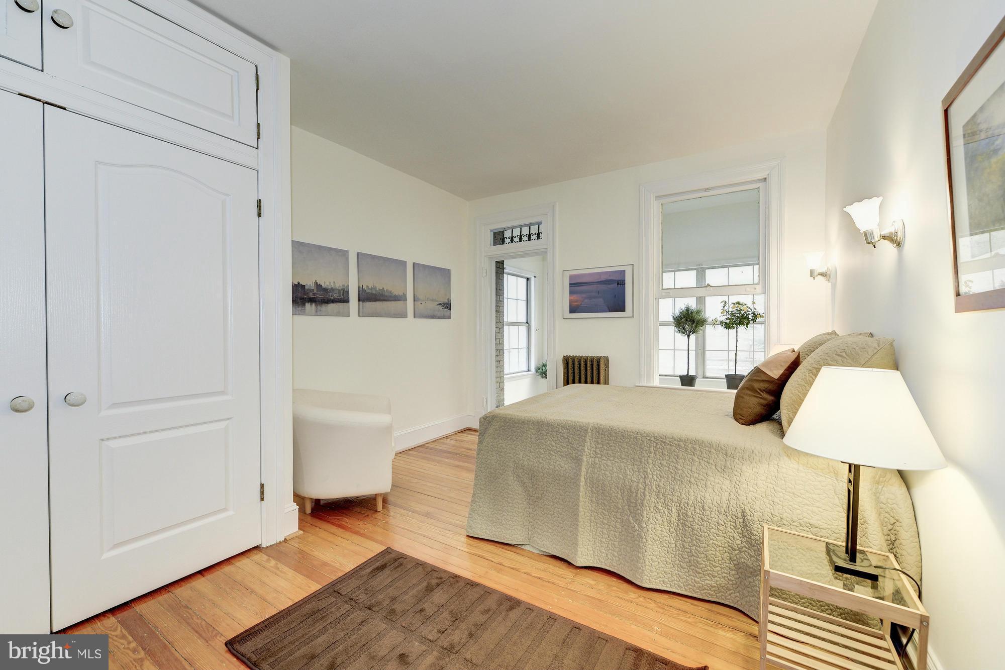 2605 Adams Mill Road Northwest, Unit 2 Washington, DC 20009 - Photo 16 of 30 a bedroom with a bed and a table