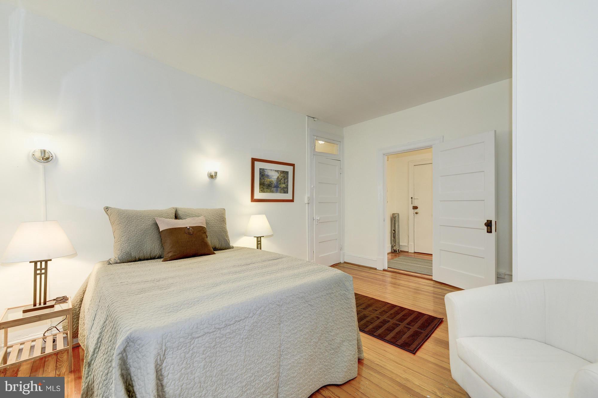 2605 Adams Mill Road Northwest, Unit 2 Washington, DC 20009 - Photo 20 of 30 a bedroom with a bed and a couch