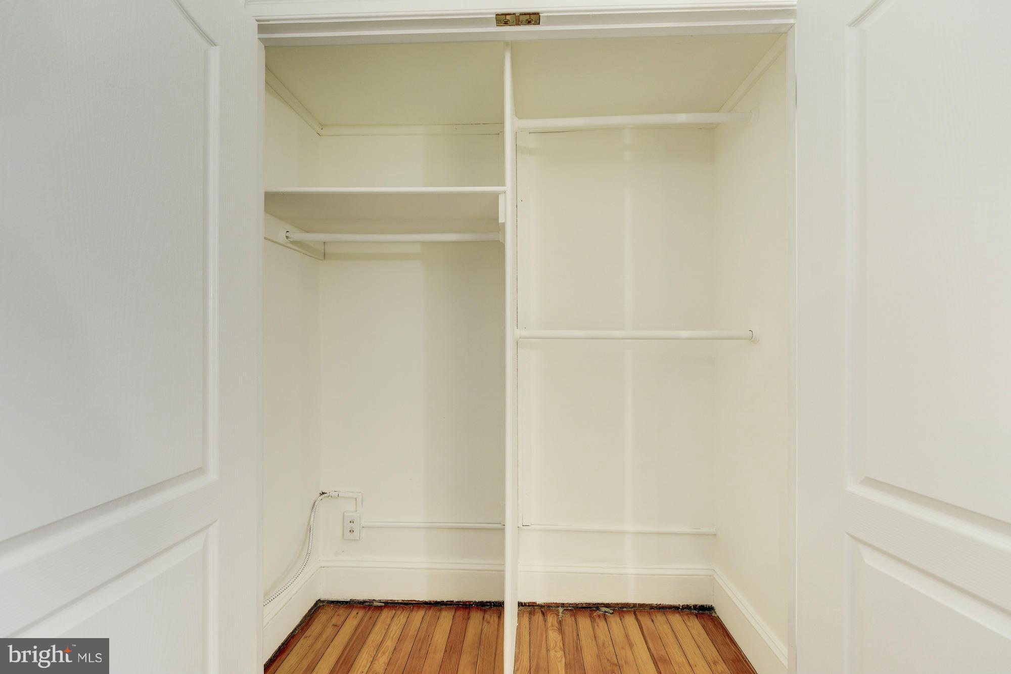 2605 Adams Mill Road Northwest, Unit 2 Washington, DC 20009 - Photo 21 of 30 a view of walk in closet with empty racks