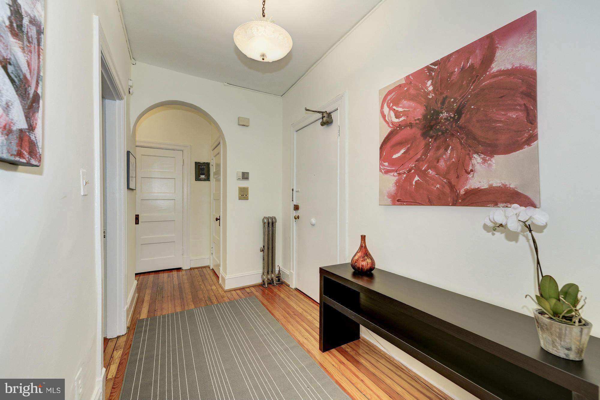 2605 Adams Mill Road Northwest, Unit 2 Washington, DC 20009 - Photo 5 of 30 wooden floor with a potted plant on the floor