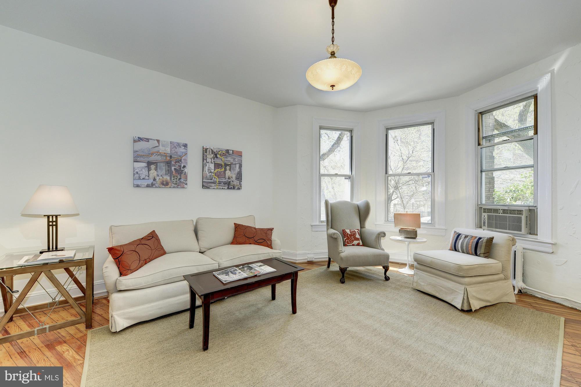 2605 Adams Mill Road Northwest, Unit 2 Washington, DC 20009 - Photo 7 of 30 a living room with furniture and a large window