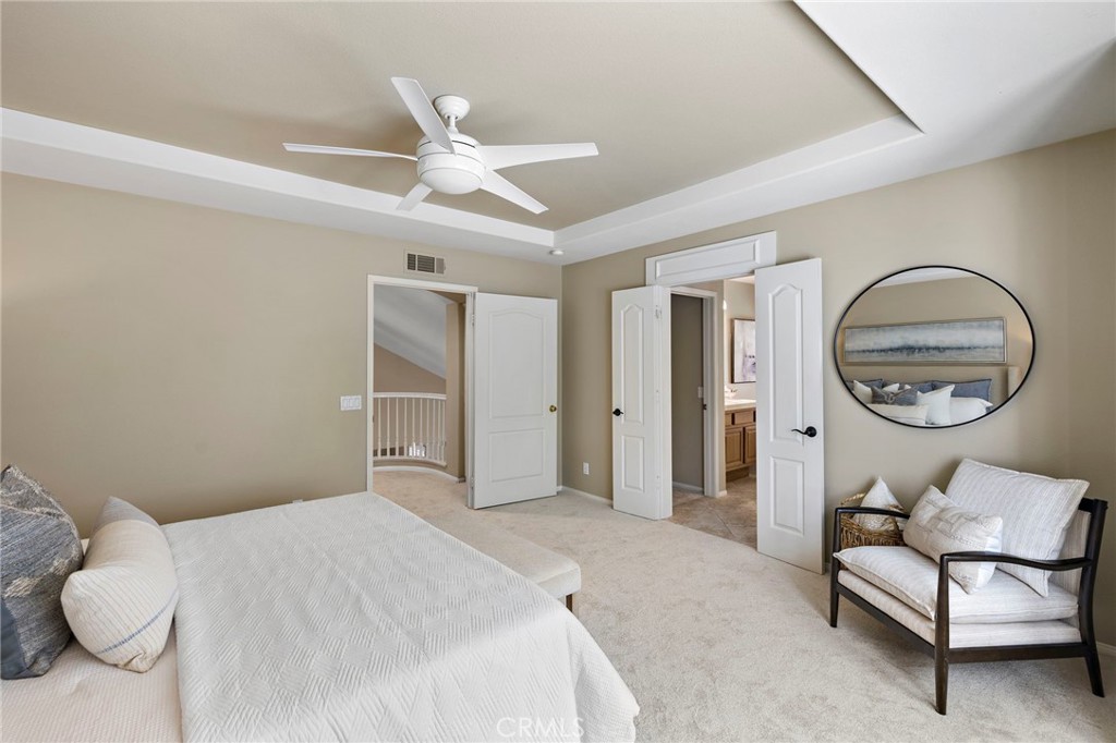 4 Celestine Circle Ladera Ranch, CA 92694 - Photo 17 of 39 a bedroom with a bed and a mirror