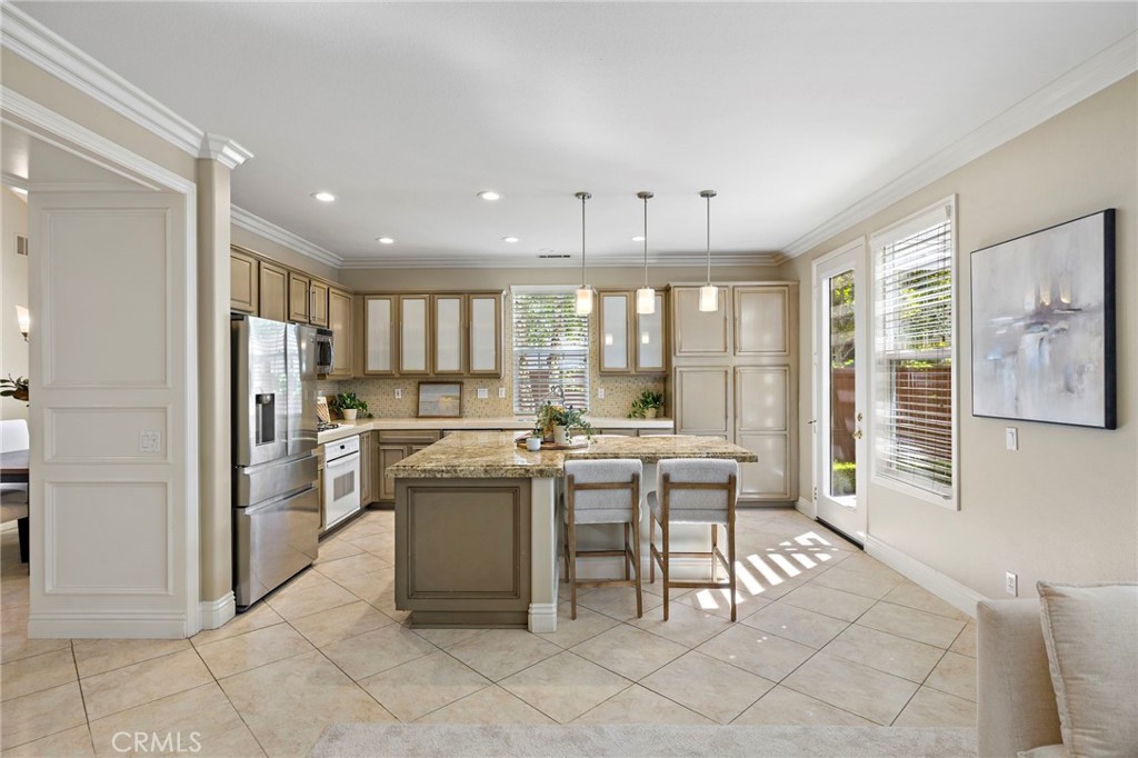 4 Celestine Circle Ladera Ranch, CA 92694 - Photo 8 of 39 a kitchen with a sink and chairs