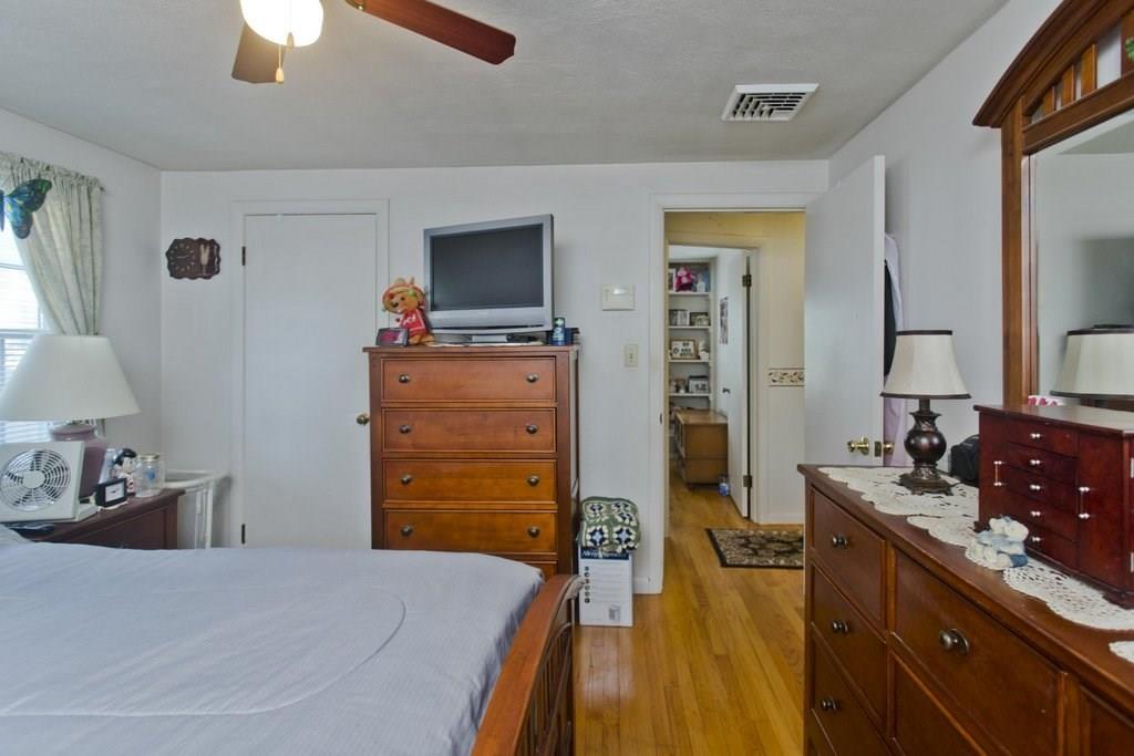 17 Arthur Street Springfield, MA 01104 - Photo 22 of 36 a bedroom with a bed and a flat tv screen on dresser