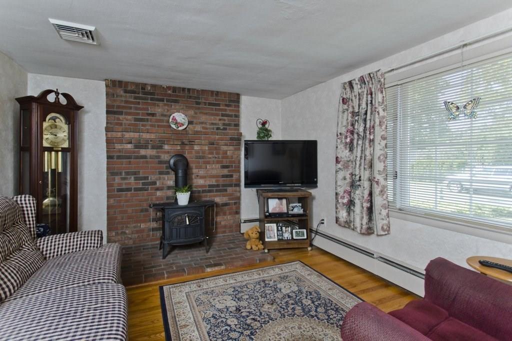 17 Arthur Street Springfield, MA 01104 - Photo 4 of 36 a living room with furniture and a flat screen tv