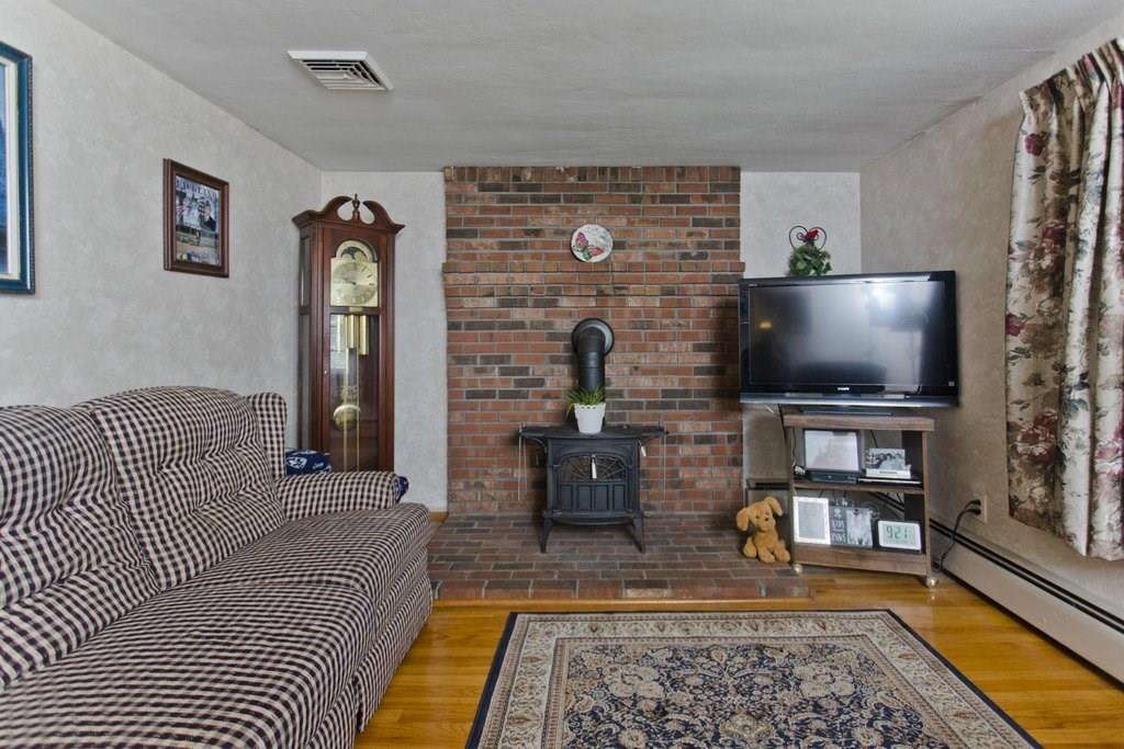 17 Arthur Street Springfield, MA 01104 - Photo 5 of 36 a living room with furniture and a flat screen tv