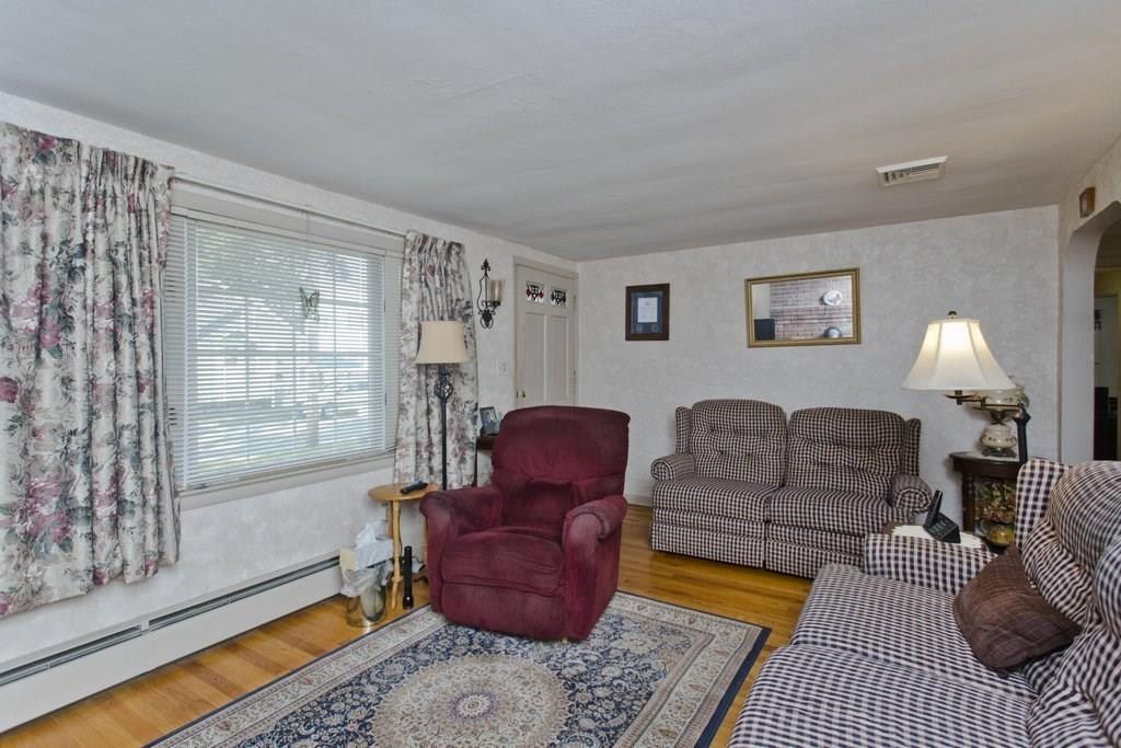 17 Arthur Street Springfield, MA 01104 - Photo 8 of 36 a living room with furniture and a window