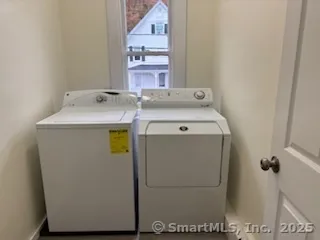 a utility room with dryer and washer
