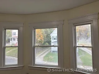 a view of lot of window and wooden floor