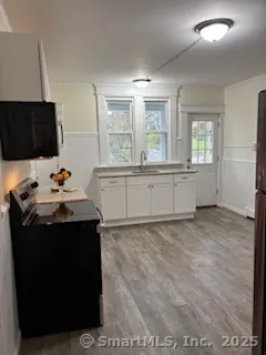 a kitchen with a sink and cabinets