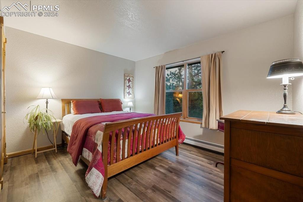 123 Maroon Lake Circle Divide, CO 80814 - Photo 27 of 47 a bed sitting in a bedroom next to a window