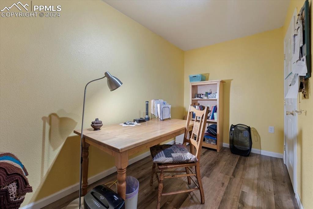 123 Maroon Lake Circle Divide, CO 80814 - Photo 44 of 47 a view of a workspace with furniture and wooden floor