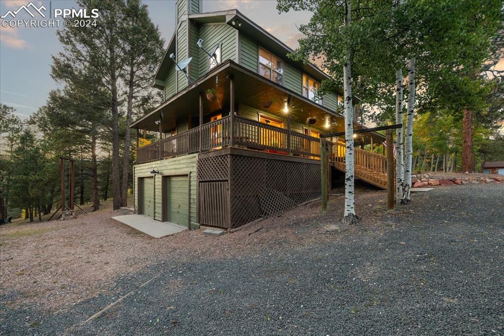 123 Maroon Lake Circle Divide, CO 80814 - Photo 46 of 47 a view of a house with a yard and garage