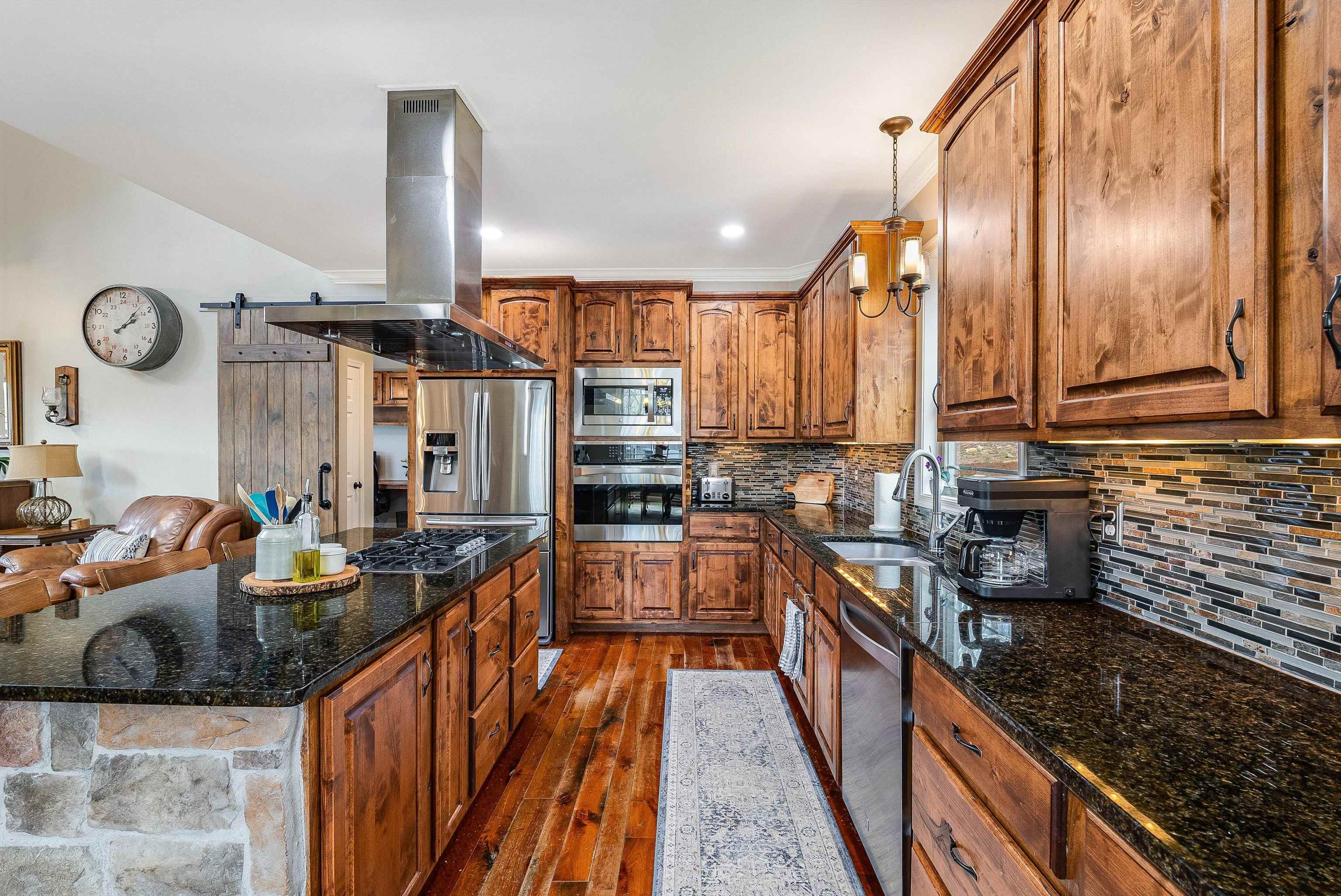 920 Wagon Shop Road Middlebrook, VA 24459 - Photo 16 of 75 a kitchen with stainless steel appliances granite countertop a sink a stove and a wooden floors