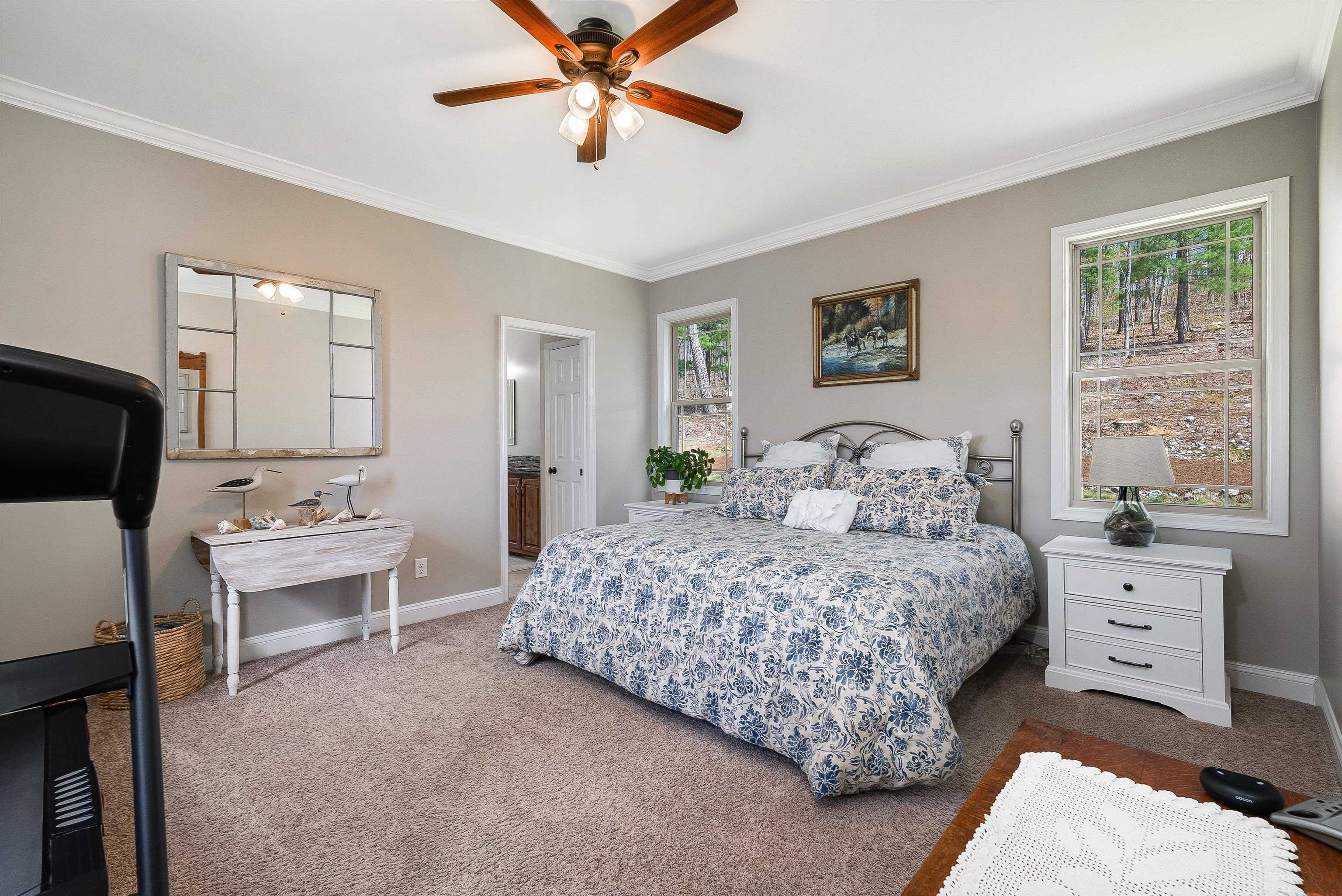 920 Wagon Shop Road Middlebrook, VA 24459 - Photo 28 of 75 a bedroom with a large bed and a chandelier