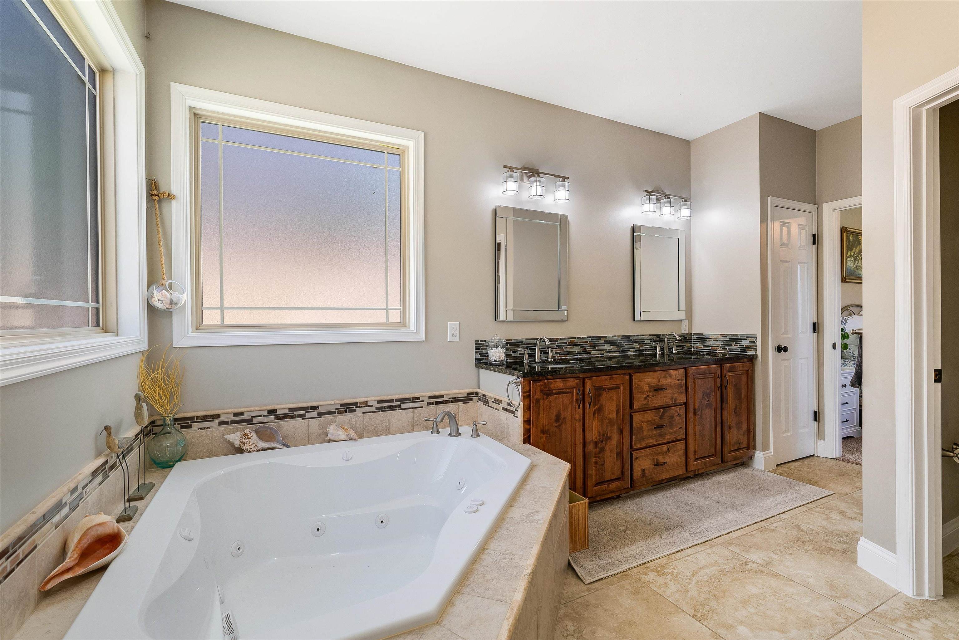 920 Wagon Shop Road Middlebrook, VA 24459 - Photo 31 of 75 a bathroom with a granite countertop tub sink and mirror