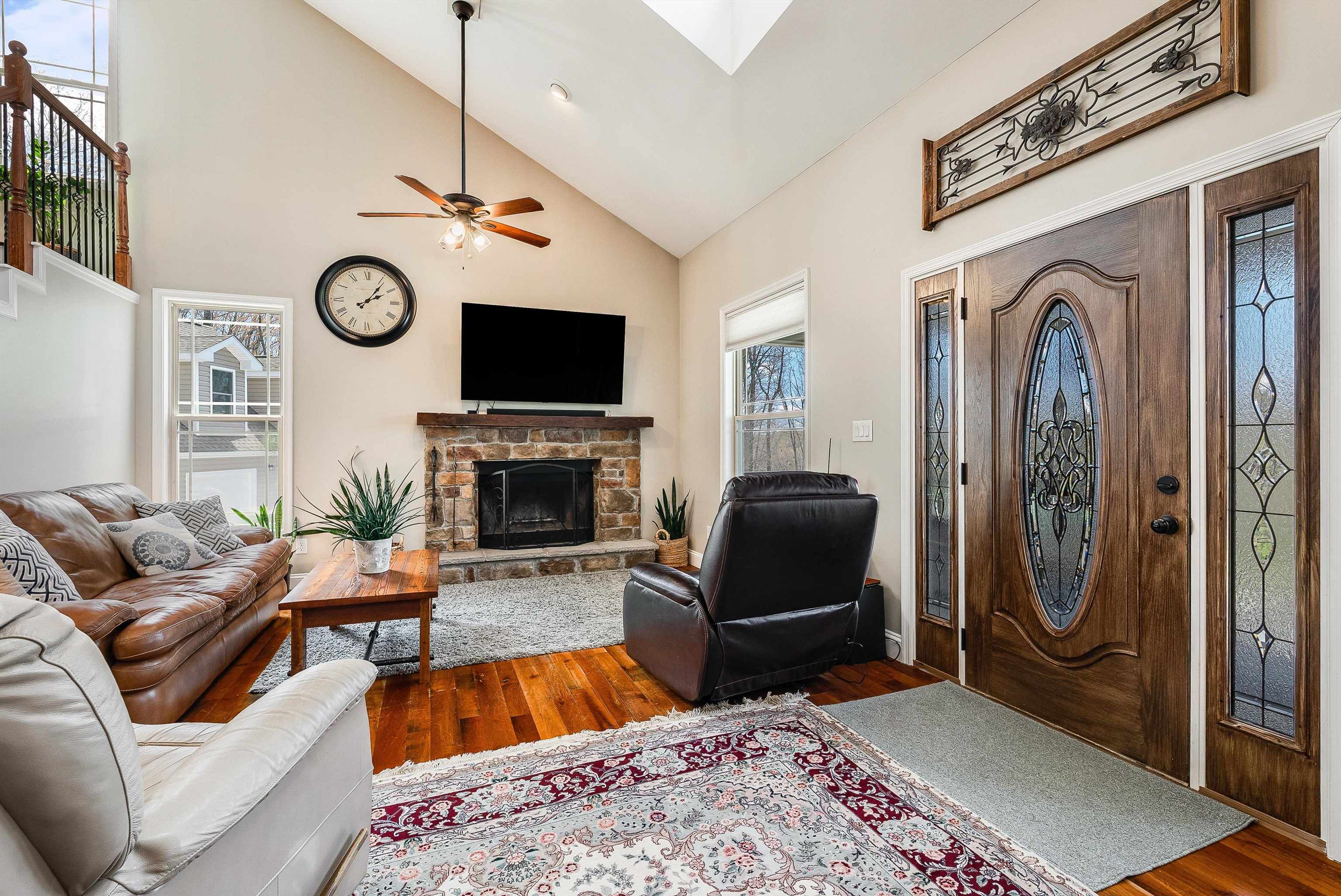 920 Wagon Shop Road Middlebrook, VA 24459 - Photo 9 of 75 a living room with furniture a flat screen tv and a fireplace