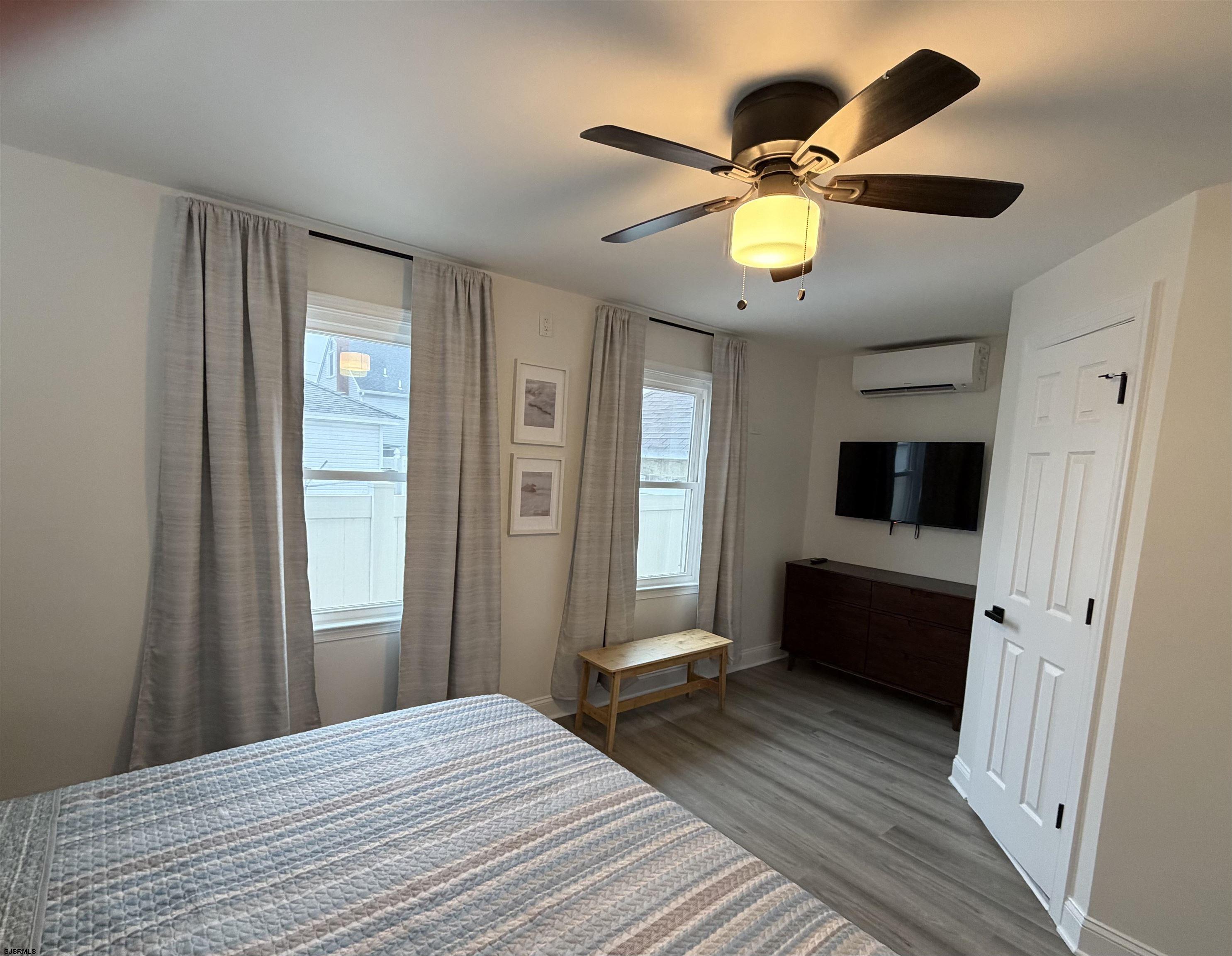 110 West Buttercup Road, Unit 5 Wildwood Crest, NJ 08260 - Photo 21 of 31 a bedroom with a bed and a window
