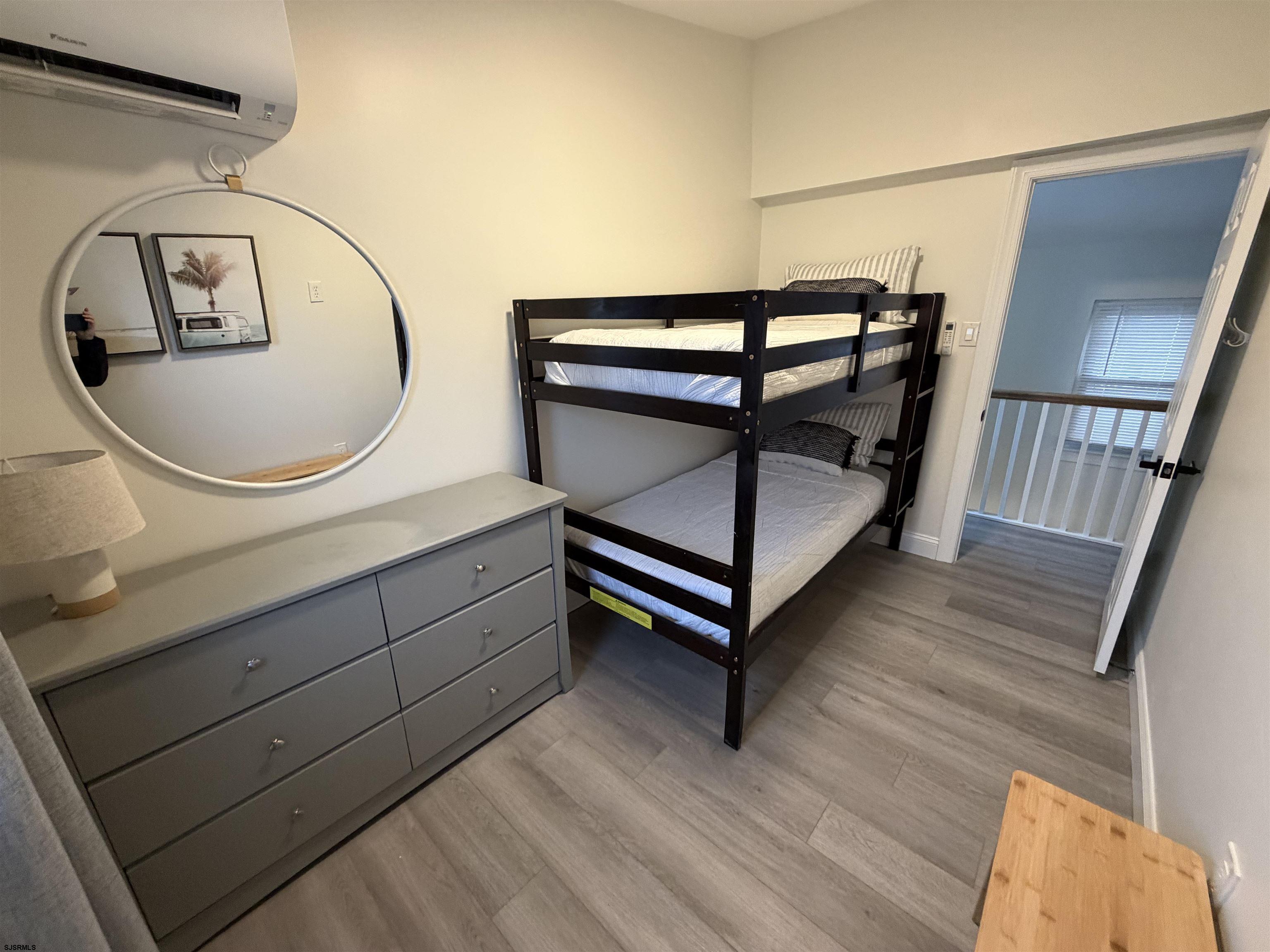 110 West Buttercup Road, Unit 5 Wildwood Crest, NJ 08260 - Photo 25 of 31 a bathroom with a sink mirror and vanity