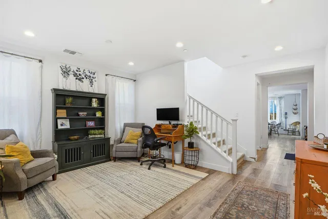 a room with furniture and a flat screen tv