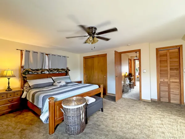 a bed room with a bed and a chandelier