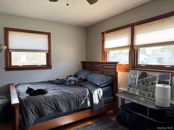 a bedroom with a bed and window