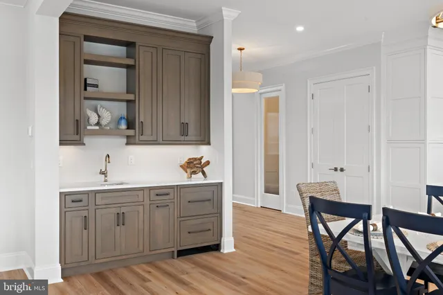 a view of an entryway with wooden floor