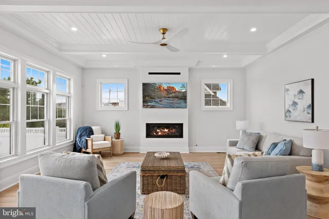 a view of kitchen with wooden floor and electronic appliances