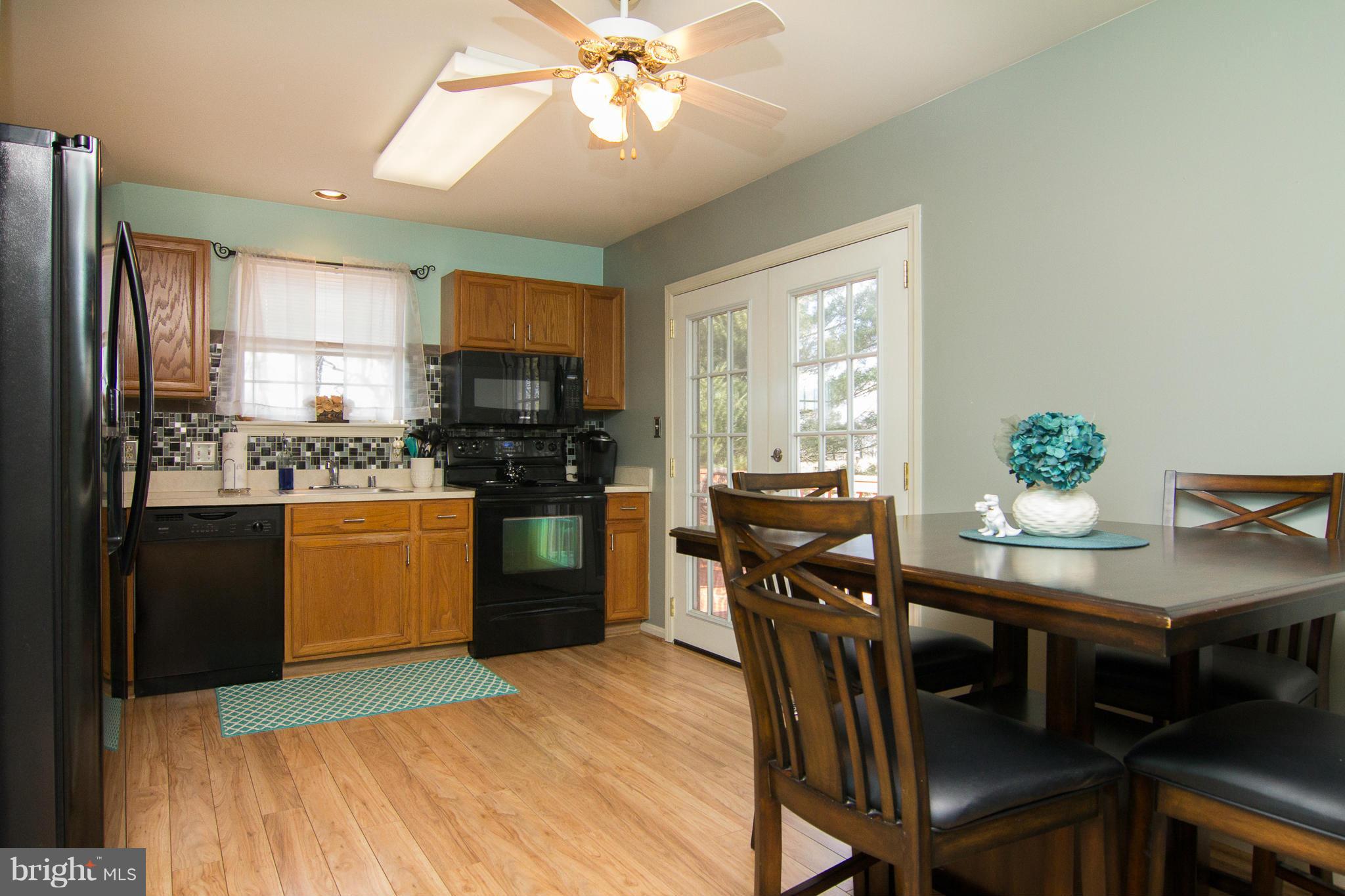 961 Firestone Road Westminster, MD 21158 - Photo 18 of 30 Kitchen w/ doors to deck