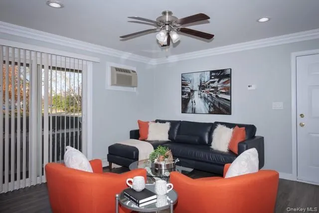 a living room with furniture and a window