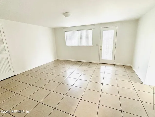 a view of an empty room and window