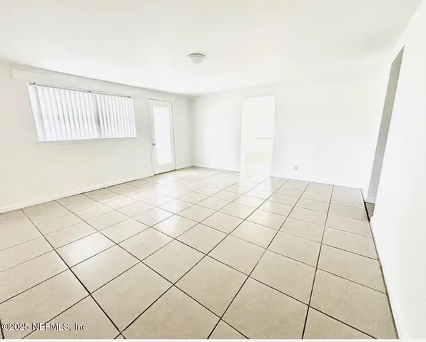 a view of an empty room and window