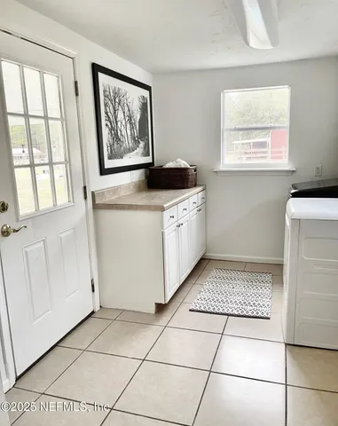 a kitchen with a cabinets and window
