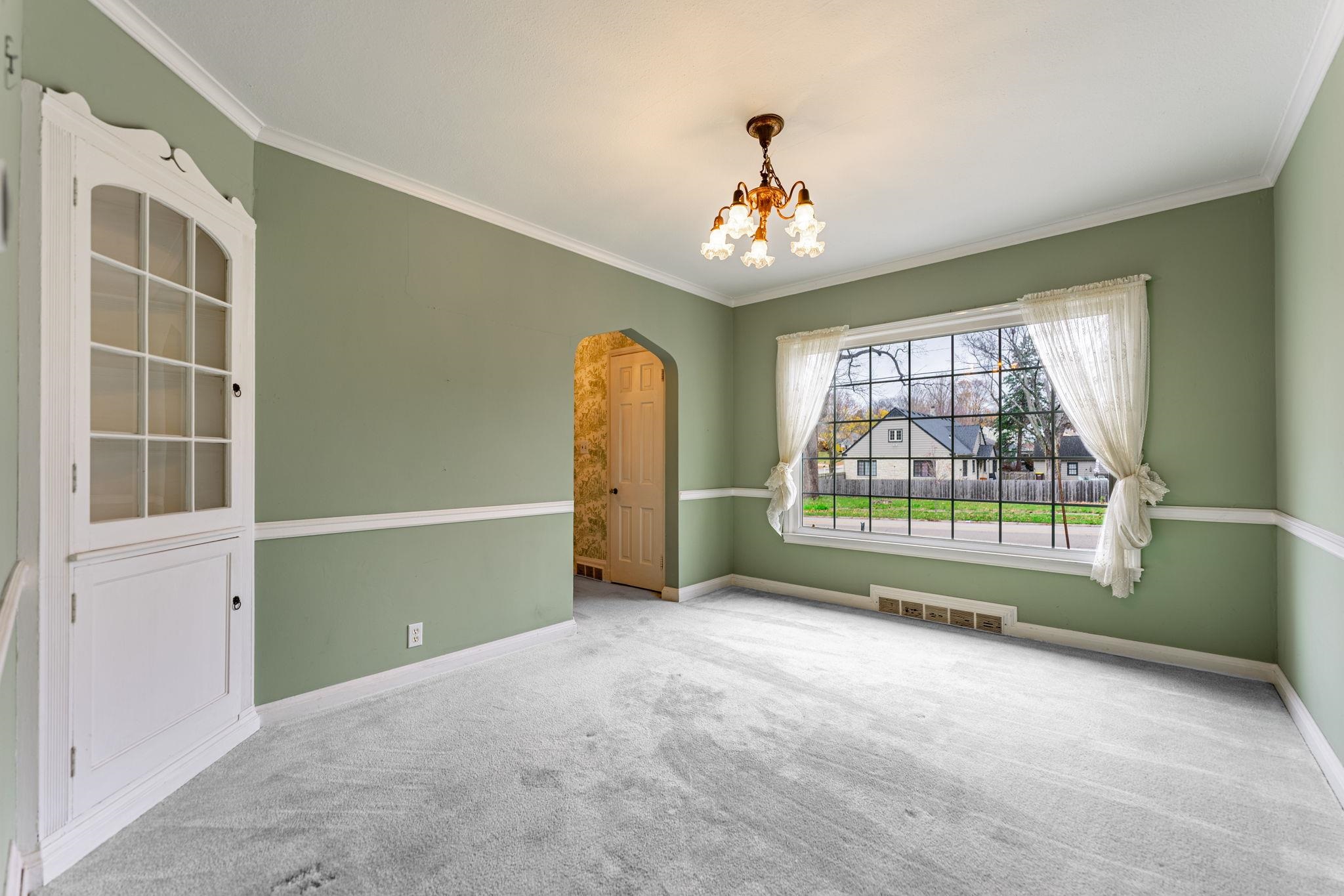 2705 Rural Street Rockford, IL 61107 - Photo 11 of 31 an empty room with windows and chandelier