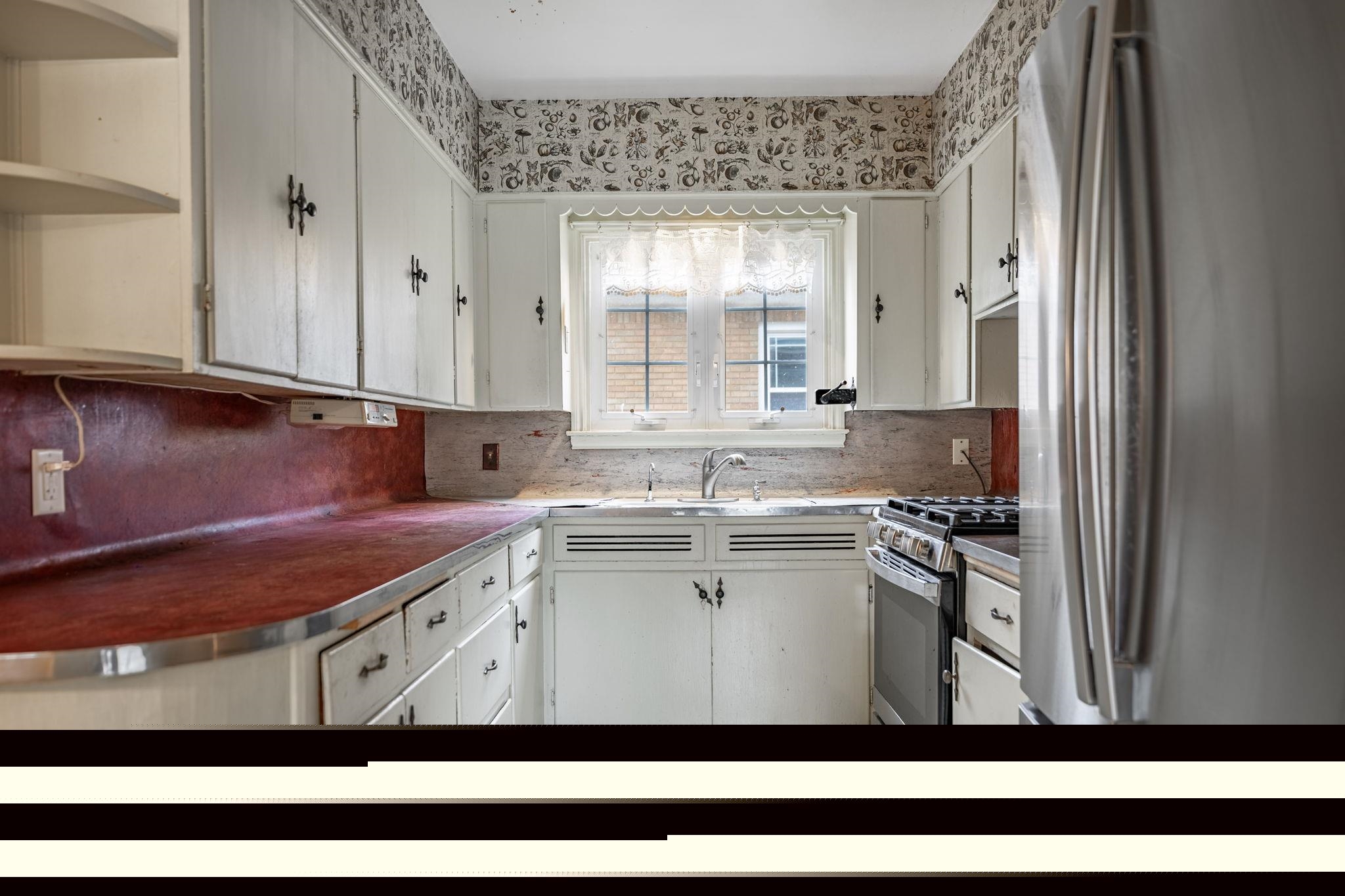 2705 Rural Street Rockford, IL 61107 - Photo 12 of 31 a kitchen with stainless steel appliances granite countertop a sink window and cabinets