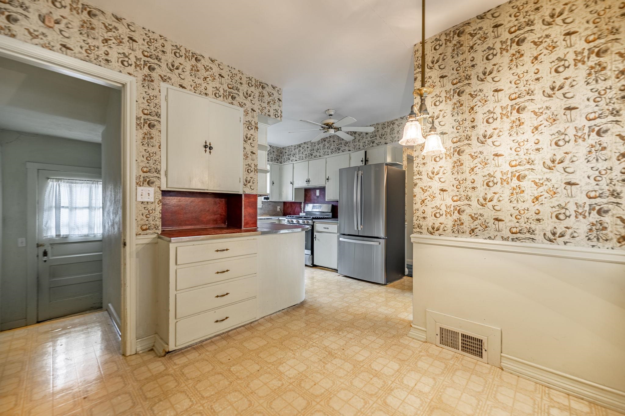2705 Rural Street Rockford, IL 61107 - Photo 15 of 31 a kitchen with white cabinets and stainless steel appliances