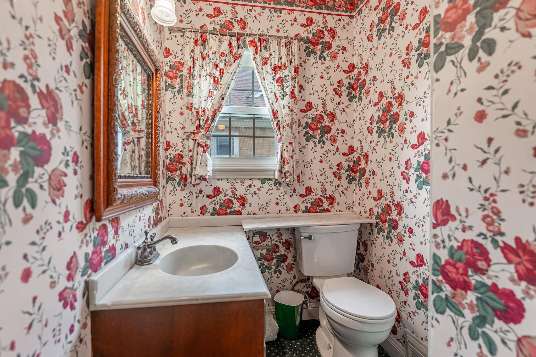 2705 Rural Street Rockford, IL 61107 - Photo 19 of 31 a bathroom with a sink toilet and mirror