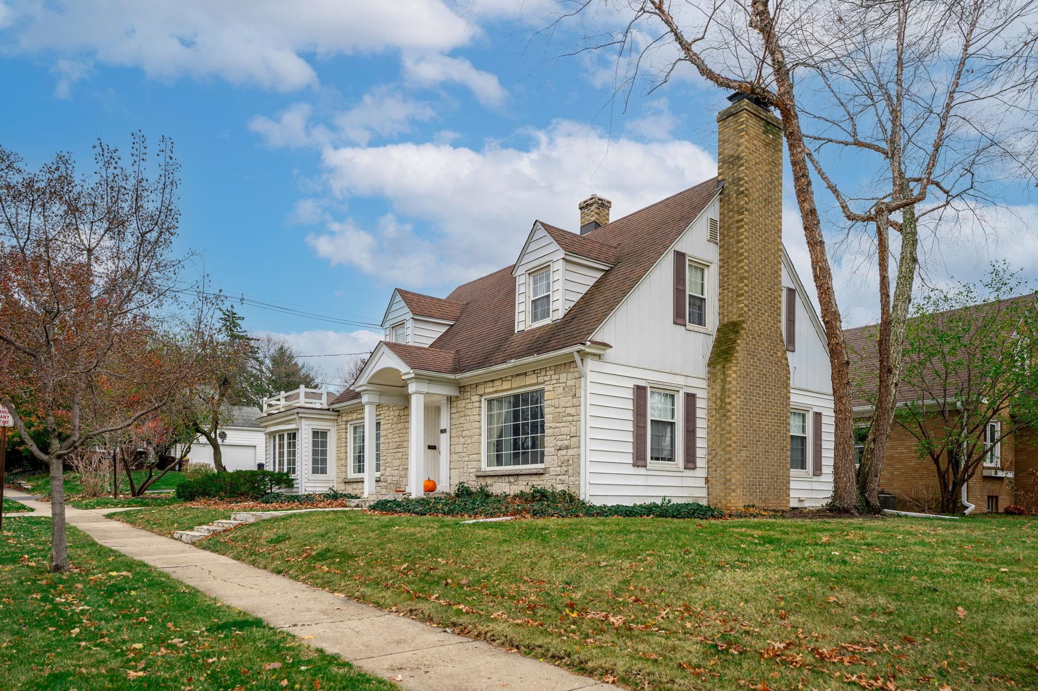 2705 Rural Street Rockford, IL 61107 - Photo 3 of 31 a view of a yard in front of a house with a fountain plants and large tree