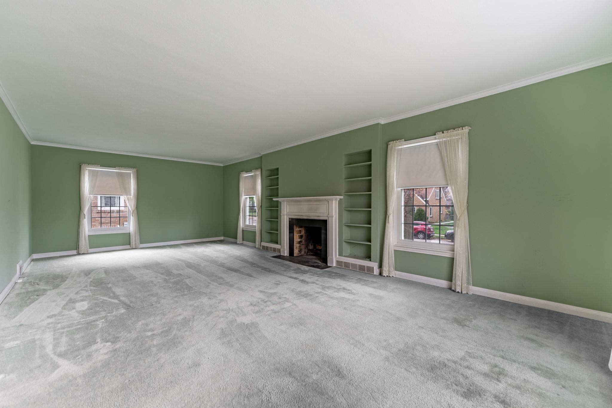 2705 Rural Street Rockford, IL 61107 - Photo 7 of 31 a view of an empty room with a fireplace