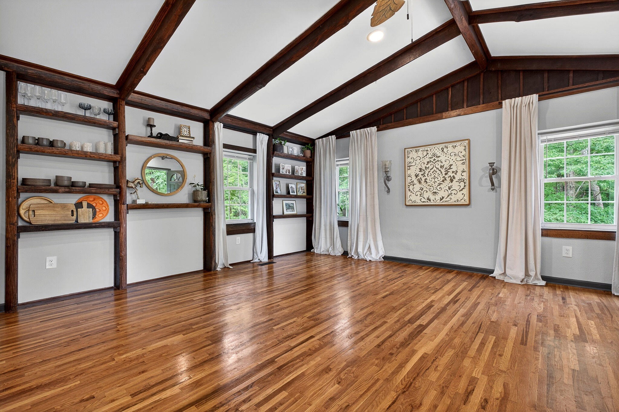 9388 Harrison Ferry Road McMinnville, TN 37110 - Photo 5 of 41 a view of an empty room with window and wooden floor