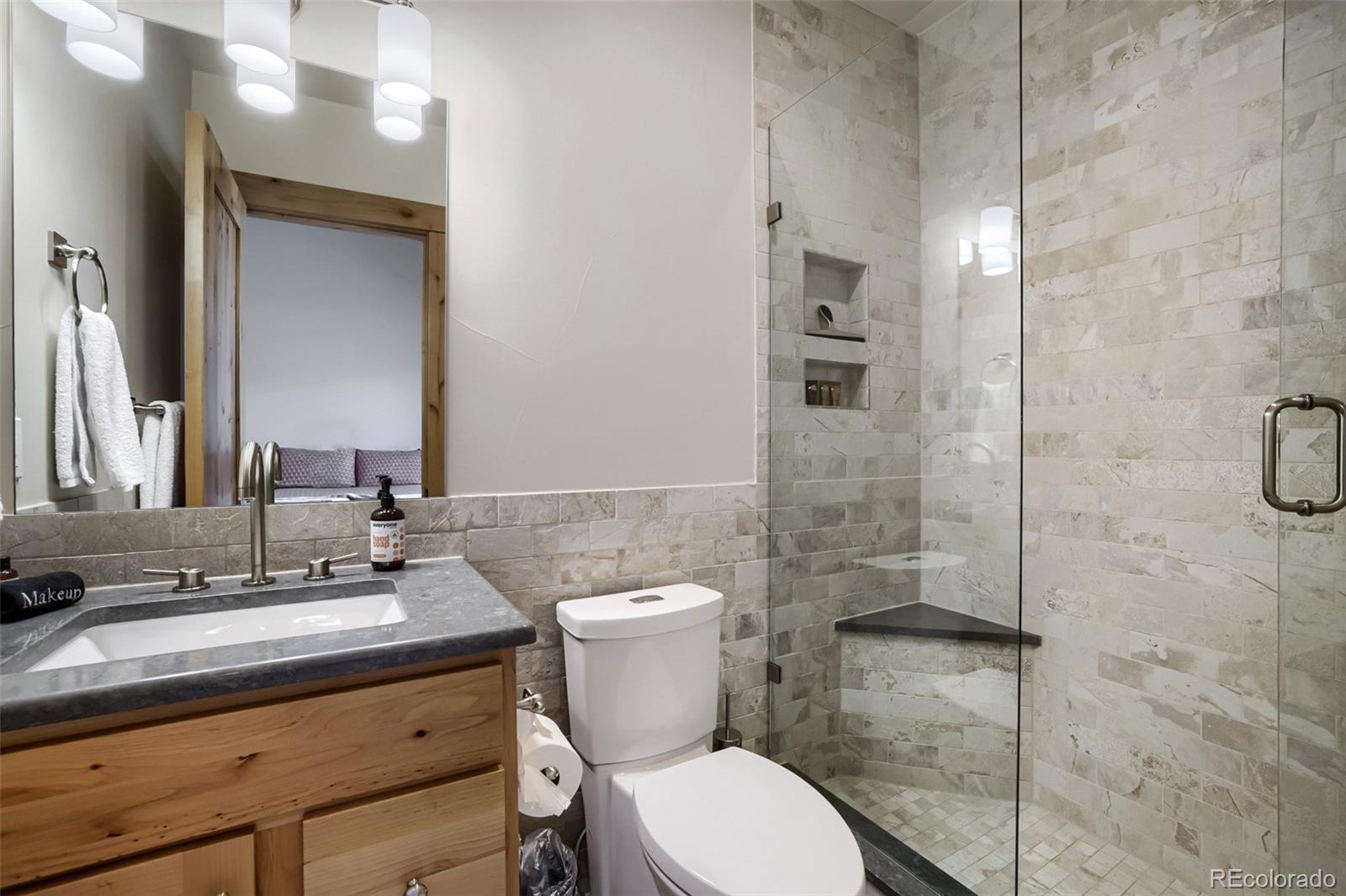 836 Maryland Creek Road Silverthorne, CO 80498 - Photo 14 of 49 a bathroom with a sink a toilet and shower