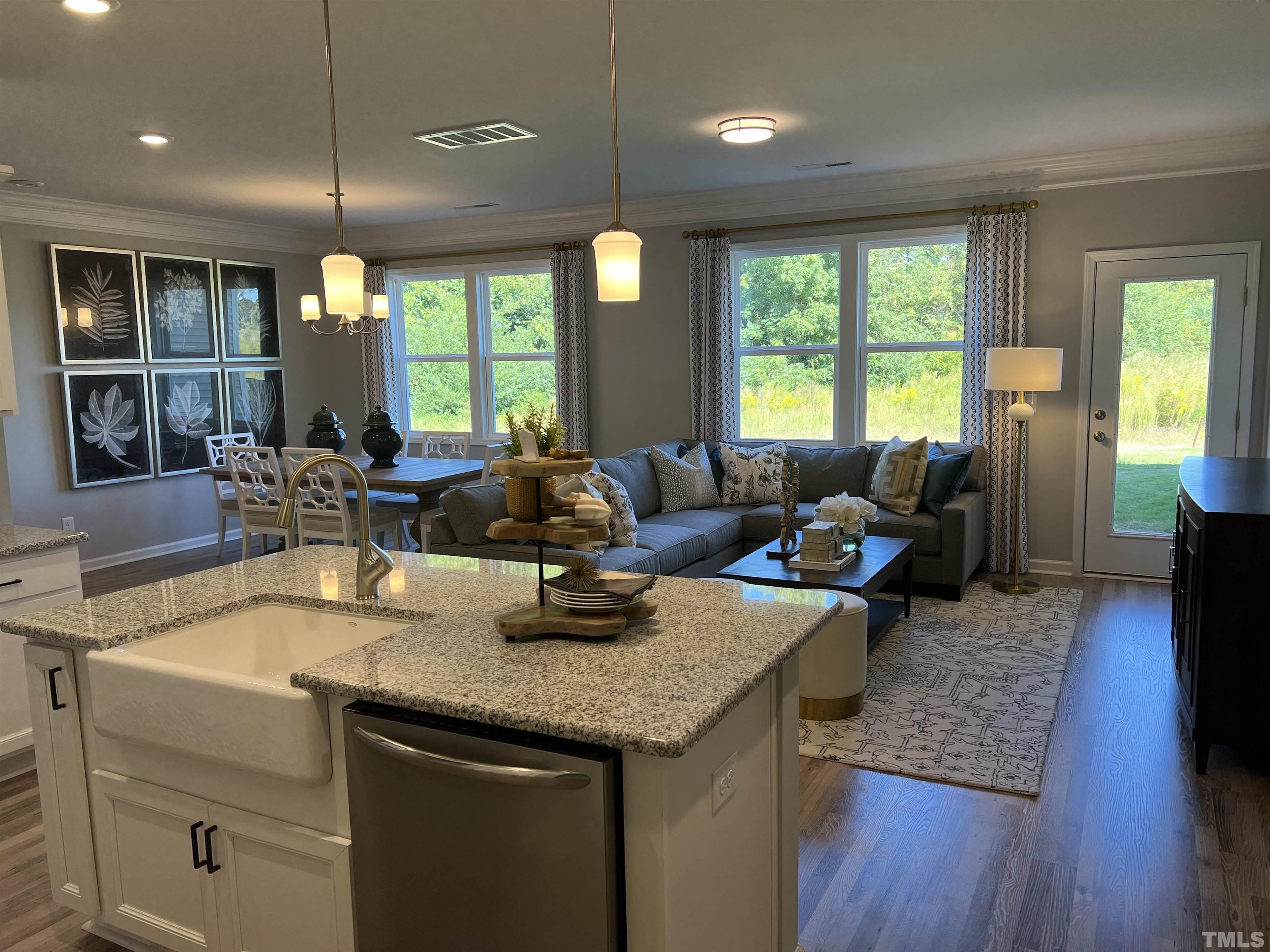 256 Shingle Oak Road, Unit TH 20 Wake Forest, NC 27587 - Photo 2 of 8 a living room with furniture and wooden floor