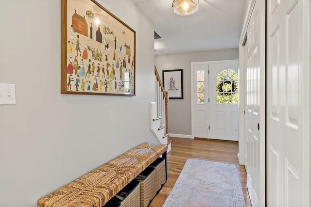 a view of an entryway with wooden floor