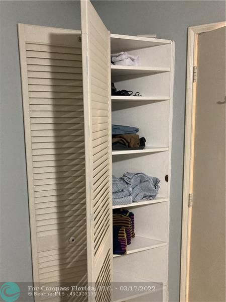 1777 Southeast 15th Street, Unit 312 Fort Lauderdale, FL 33316 - Photo 15 of 17 a room with a walk in closet and a window
