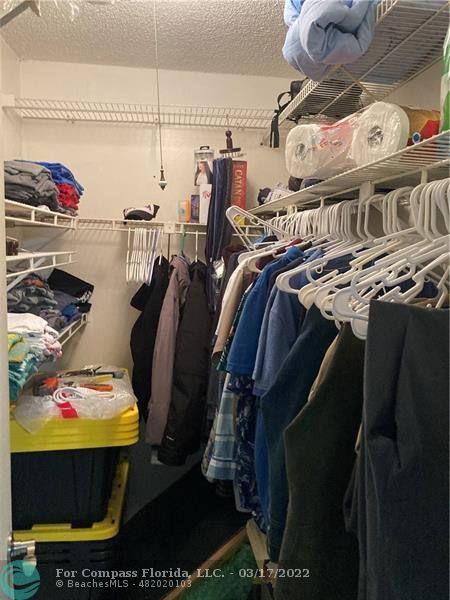 1777 Southeast 15th Street, Unit 312 Fort Lauderdale, FL 33316 - Photo 16 of 17 a view of walk in closet with clothes and shoes