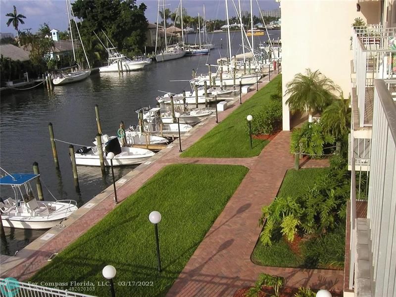 1777 Southeast 15th Street, Unit 312 Fort Lauderdale, FL 33316 - Photo 8 of 17 a view of a lake with a yard